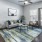 a living room with a rug and a table