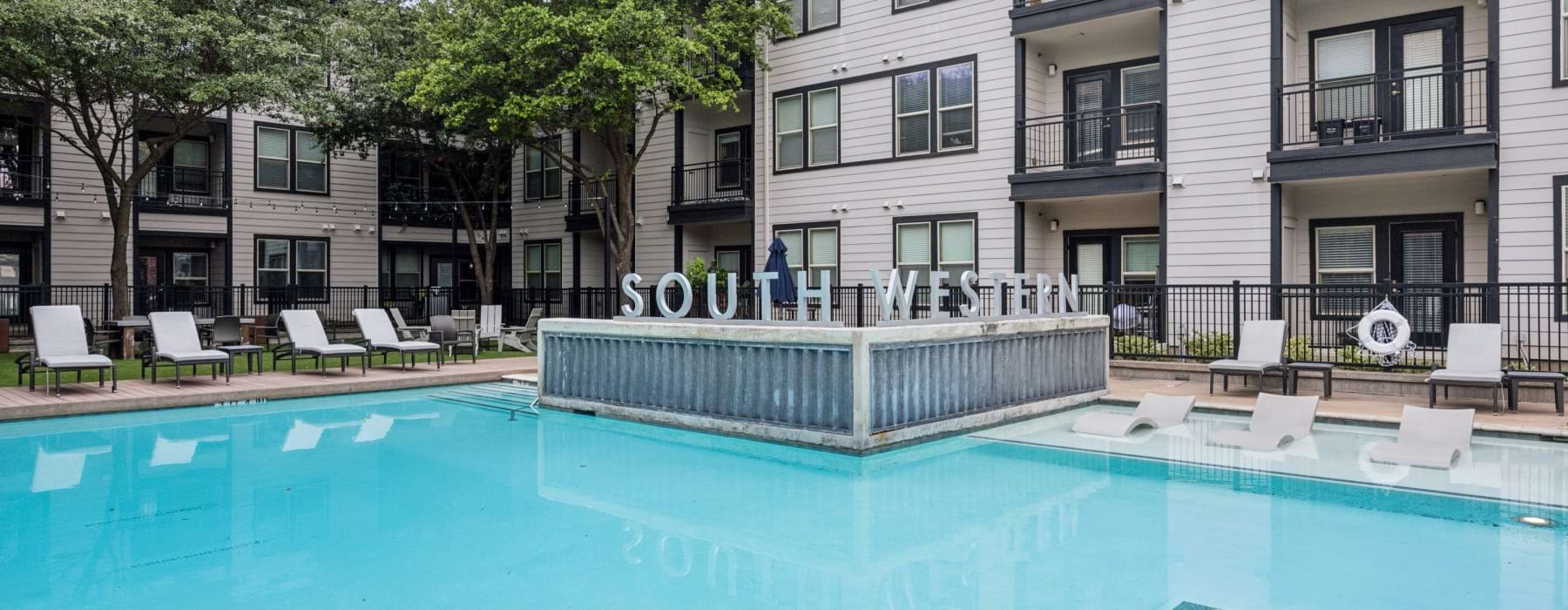 a swimming pool in front of a building